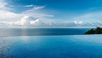 Obraz premium A luxury hotel infinity pool with the ocean at its edge