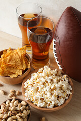 Beer with snacks and a rugby ball