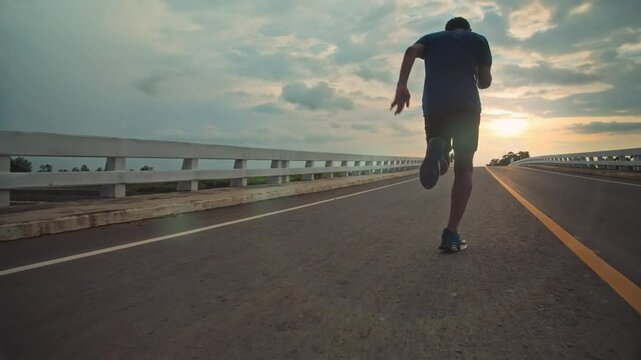 runners is running on the road at outdoors.healthy lifestyle and sport concepts.Sprinting Endurance Workout Training.running for Striding Towards the Future.The Determined Runner.
