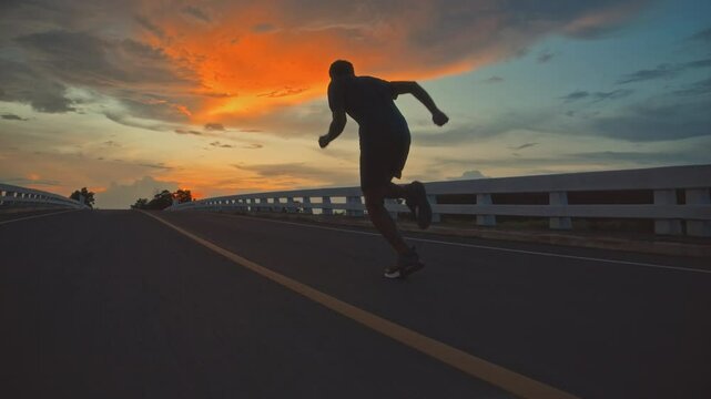 runners is running on the road at outdoors.healthy lifestyle and sport concepts.Sprinting Endurance Workout Training.running for Striding Towards the Future.The Determined Runner.