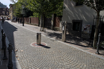 Retractable pole or automatic bollard to stop traffic in the pedestrian downtown district of...