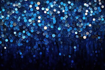 Blue sequin background featuring holiday themed abstract glitter with sparkling lights Brightly colored fabric sequins create a defocused fashion look.