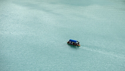 boat in the water lake bled slovenia (european travel tourism destination) castle island rent hire...