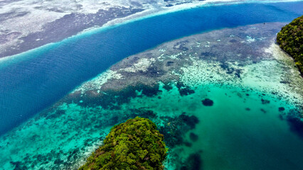 Aerial View of the blue waters and lush greenery of Palau's Rock Islands