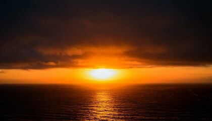 Obraz premium A big sun rises under the dark sky