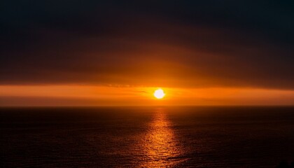 Obraz premium A big sun rises under the dark sky