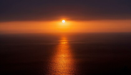 Obraz premium A big sun rises under the dark sky
