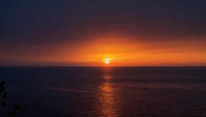 Fototapeta premium A big sun rises under the dark sky