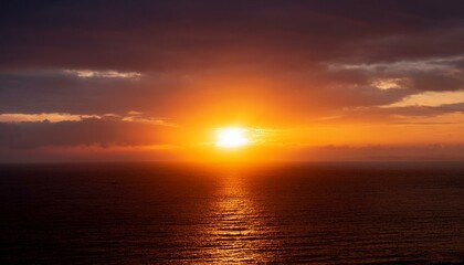 Naklejka premium A big sun rises under the dark sky