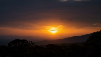 Obraz premium A big sun rises under the dark sky