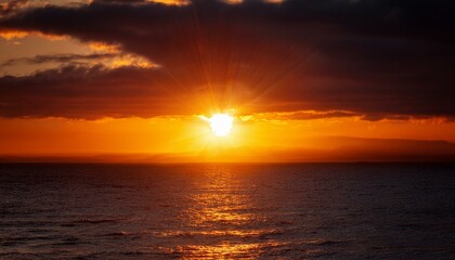 Obraz premium A big sun rises under the dark sky