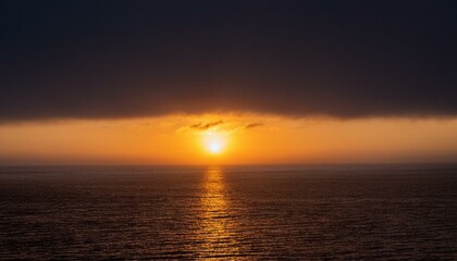 Obraz premium A big sun rises under the dark sky