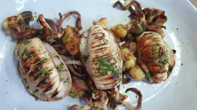 cuttlefish calamari squid grill with potato close up seafood dish 4k