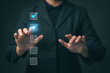 Business performance checklist concept Young business woman using laptop surveys online checklist Complete the digital form checklist via the internet...