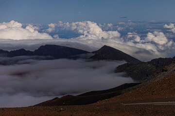 Landscape view at night with stars at the top of Haleakala National Park in Hawaii.