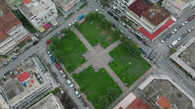 Aerial view of Paralia Katerinis, Greece, revealing a charming square nestled amidst buildings, capturing the essence of a greek holiday by the Aegean Sea