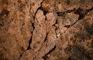 Cracked Brown wall texture. Dirty Grunge Stone background. Sandy Rough structure. Abstract texture. Rock surface with cracks. Urban design. Focus on wall. noisy, similar others