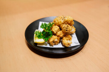 Mouth-watering Japanese appetizer, served on ceramic little plate ready to eat