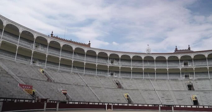 Amazing zoom in shot of the stands at the Las Ventas bullring in Madrid recorded on a summer morning.