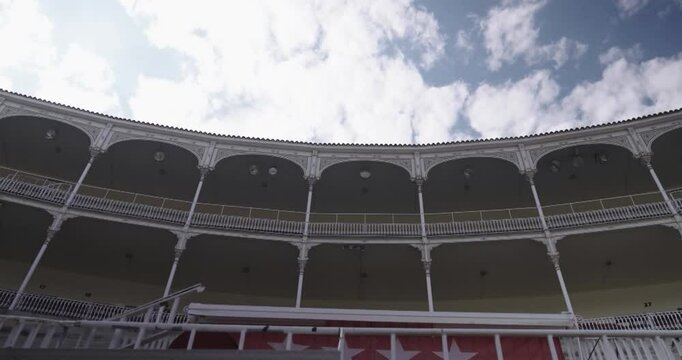 Beautiful general shot of the boxes and stands from inside the Las Ventas bullring in Madrid recorded on a cloudy morning.