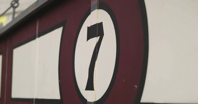 Beautiful slow motion shot with zoom of the number 7 stands of the Las Ventas bullring in Madrid during the day.