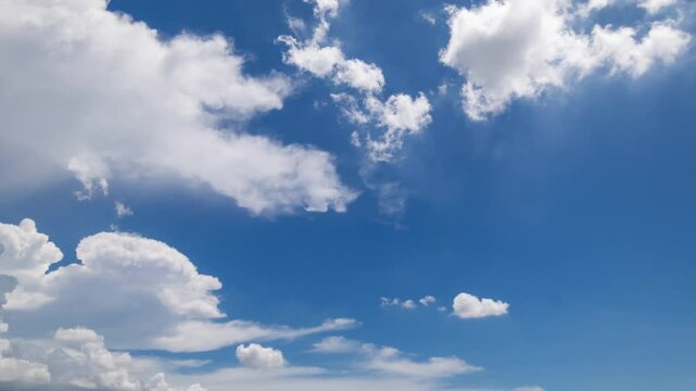 clear blue sky background,clouds with background, Blue sky background with tiny clouds. White fluffy clouds in the blue sky. 
Captivating stock photo featuring the mesmerizing beauty of the sky and cl