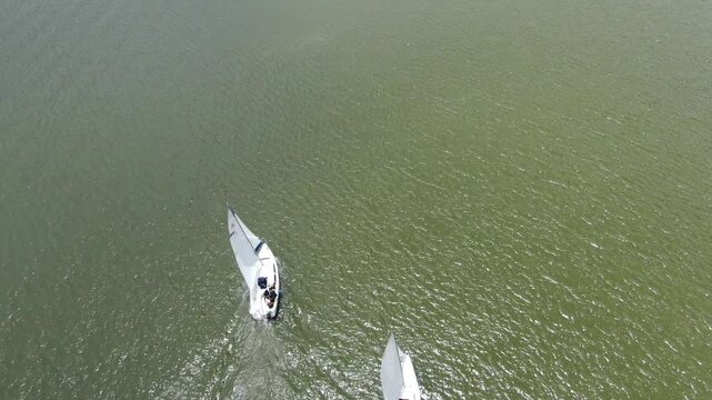 Drone headshot over the Tomine lagoon with sailboats in Colombia