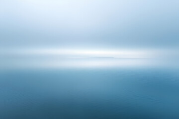 Drifting fog over a still lake at dawn, foggy weather, calm and ethereal