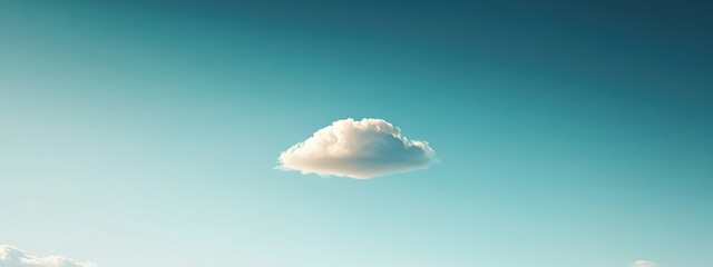 Lone Cloud in Expansive Azure Sky, a solitary cloud drifting peacefully amidst a vast, uninterrupted blue expanse, evoking tranquility and freedom