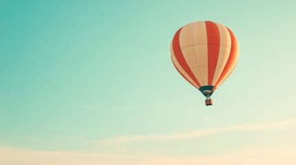 Fototapeta premium Lone Hot Air Balloon Soaring in a Blue Sky, Vibrant Colors Against a Clear Horizon, Peaceful and Serene Atmosphere