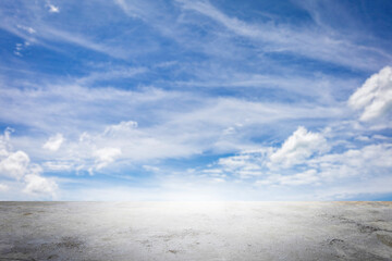 Wide empty grunge cement counter table top on blue sky clouds white light background for business...