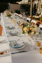 Elegant wedding table setting with flowers and glasses, perfect for a romantic celebration