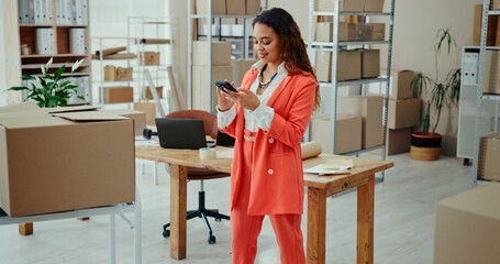 Delivery, supply chain and woman on smartphone for shipping, distribution and small business...