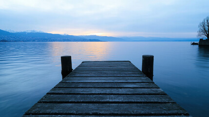 Fototapeta premium Calm Waters at Dusk with Pier Reflection