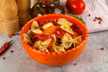 Italian pasta farfalle with pepperoni