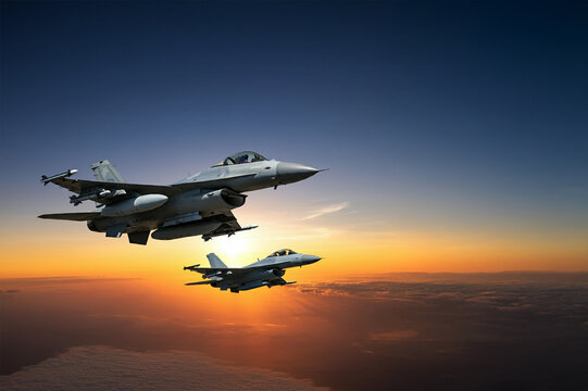 military fighter jets - modern armed military fighter jets flys in the sky