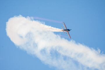 aerobatic air show plane fighter with smoke