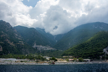 orthodox christian monastery sits on mountain side of mount athos