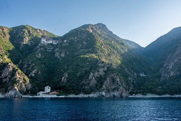 orthodox christian monastery sits on mountain side of mount athos