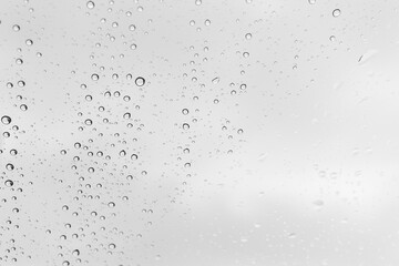Water drops background, backdrop glass covered with drops of water. bubbles in water