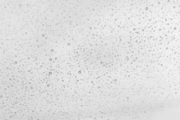 Water drops background, backdrop glass covered with drops of water. bubbles in water