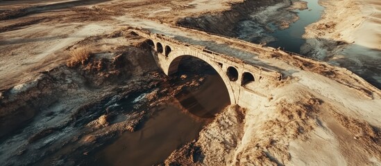Ancient Stone Bridge in Arid Landscape