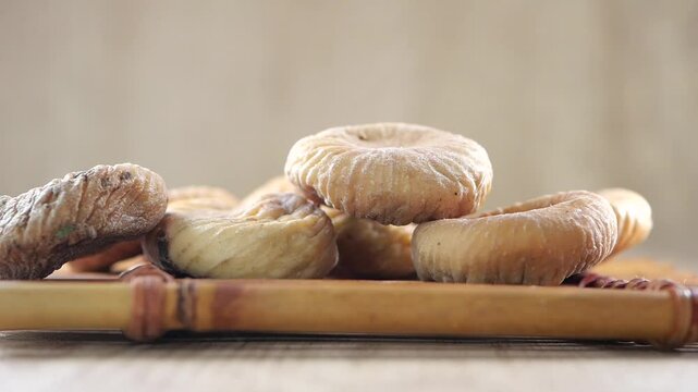 slow motion of Dried fig fruits dropping on table 