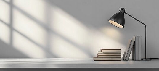 A modern study desk with books and a lamp in a well-lit room, leaving copy space above