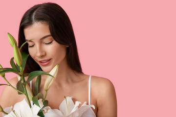 Beautiful young woman with white lily flowers on pink background, closeup