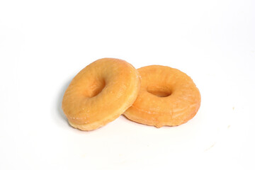 Sweet delicious glazed donuts on white background