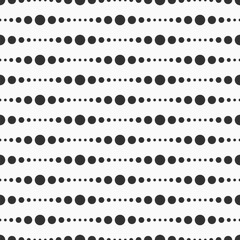 Vector seamless pattern. Different sizes dots seamless pattern. Black and white seamless vector background. Abstract geometry black and white halftone polka pattern.