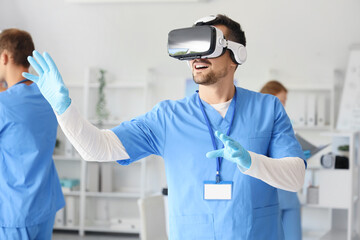 Male doctor using VR glasses in clinic