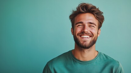 Obraz premium Portrait of a happy handsome man in a shirt with laughing