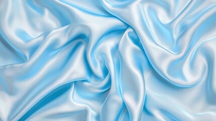 Obraz premium A close-up view of smooth, light blue satin fabric, showcasing its soft texture and flowing appearance.